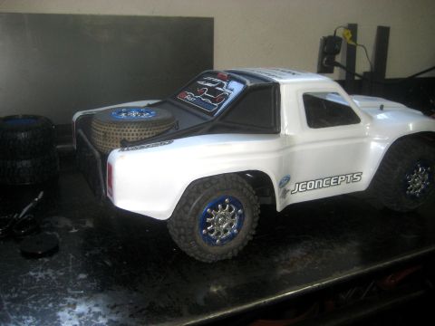 1996 Ford Bronco - This RC truck features JConcepts branding and a spare tire mounted in the bed.