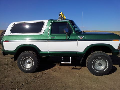 1979 Ford Bronco - This two-tone green and white 1979 Ford Bronco features off-road tires and a roof-mounted light bar.