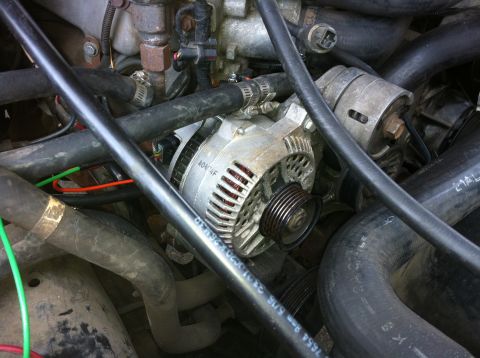1992 Ford F-150 - Alternator installed after notching the bracket rib to fit.