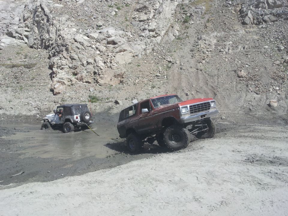 Red 1978 Ford Bronco with lifted suspension