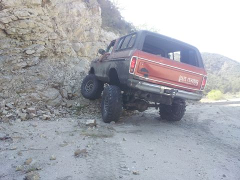1978 Ford Bronco - This lifted 1978 Ford Bronco navigates a rocky off-road trail.