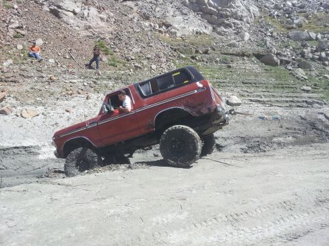 1978 Ford Bronco - 1978 Ford Bronco stuck in mud off-road.