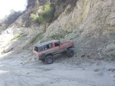 1978 Ford Bronco - This classic 1978 Ford Bronco is navigating a challenging off-road trail.