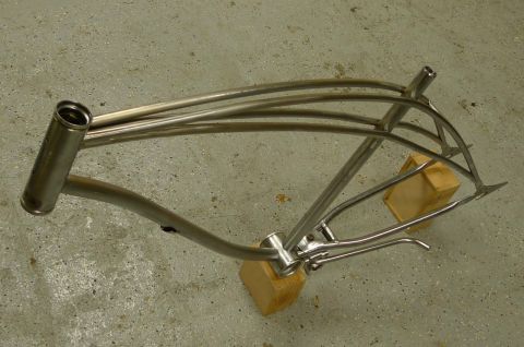 1994 Ford Bronco - A custom bicycle frame sits on a concrete floor, awaiting assembly.