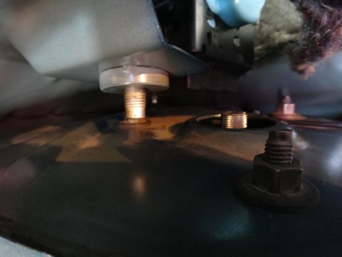 1995 Ford Taurus - Close-up view of a suspension component, likely a coilover mount, with visible hardware.