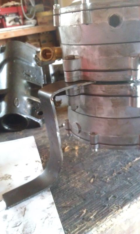 1978 Ford Bronco - Close-up view of a propane tank regulator assembly, showing a brass fitting and a metal bracket.