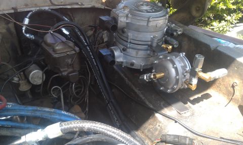 1978 Ford Bronco - Propane conversion system installed in the engine bay of an older vehicle.