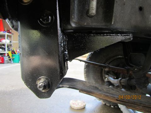 1984 Ford Bronco - Close-up view of the frame and leaf spring suspension system on a 1984 Ford Bronco.