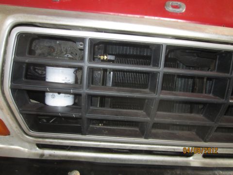 1979 Ford Bronco - Oil filter installed in the front grille of a 1979 Ford Bronco.
