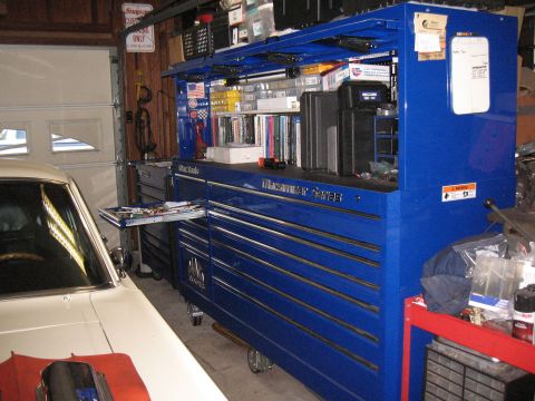 1994 Ford Bronco - Mac Tools toolbox in a garage, with a car part in the foreground.