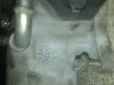 2000 Ford Crown Victoria - Close-up of an engine component showing stamped identification numbers.