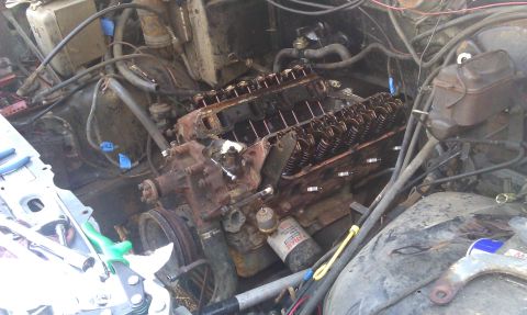 1986 Ford Bronco - Disassembled V8 engine in engine bay, likely undergoing repairs or maintenance.