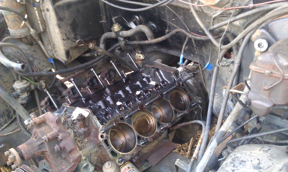 engine block with pistons visible, looks like it's being worked on