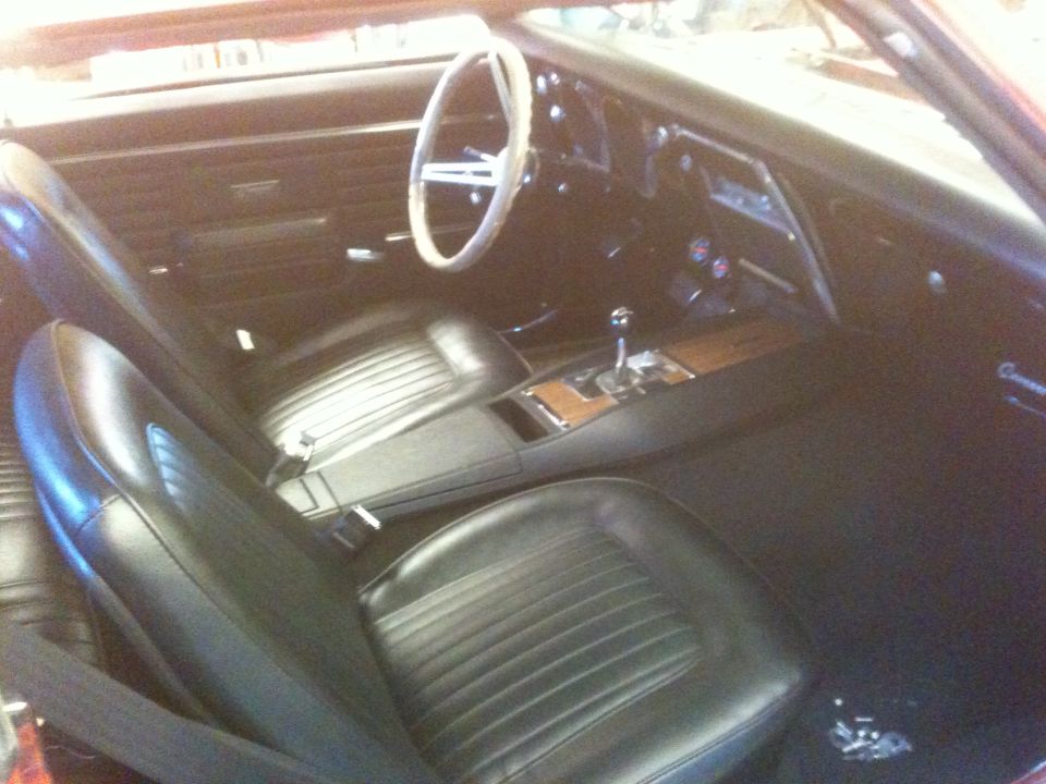 1968 Chevrolet Camaro interior with black seats and wood trim