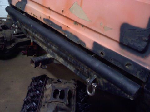 1978 Ford Bronco - Detail of a vehicle's side, showing a step and body panel.