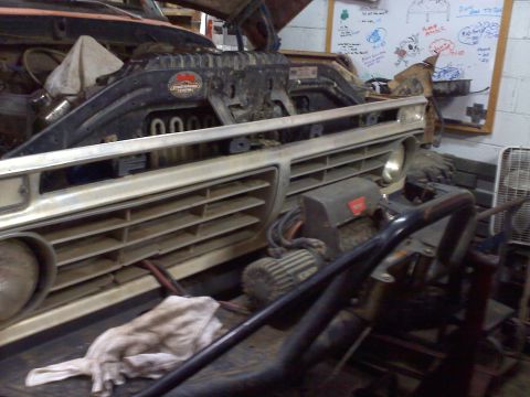 1978 Ford Bronco - The distinctive grille of a 1978 Ford Bronco is visible in this close-up shot.
