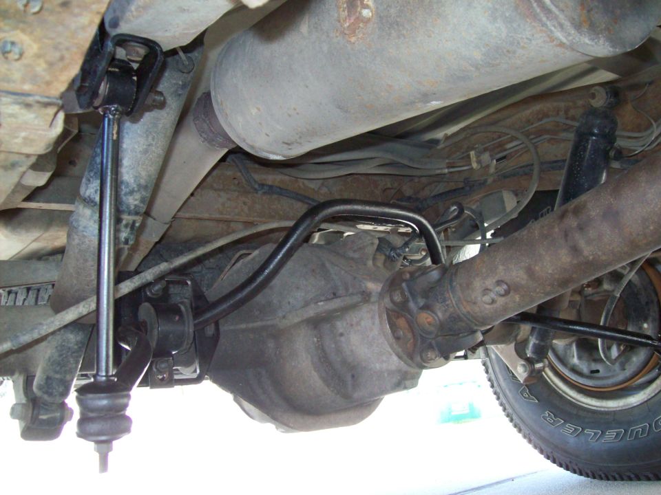 Underbody view of vehicle suspension and tire