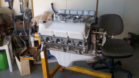 1978 Ford Bronco - Ford V8 engine on an engine stand in a garage setting.