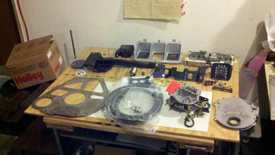Holley box and engine parts including a carburetor and intake manifold