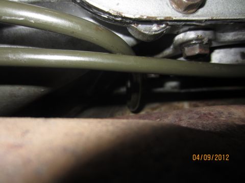 1979 Ford Bronco - Close-up view of transmission lines and exhaust pipe, dated 04/09/2012.