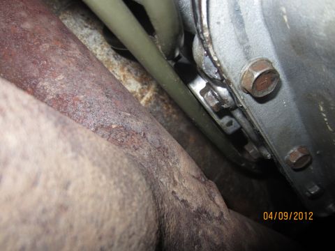1979 Ford Bronco - Undercarriage view showing exhaust pipes and transmission components, dated 04/09/2012.