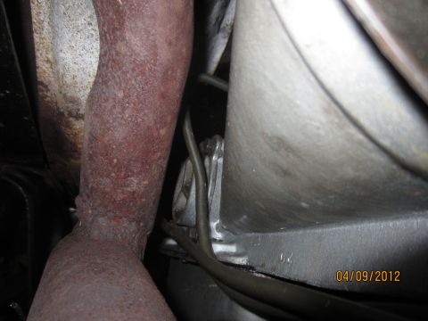 1979 Ford Bronco - Close-up view of an exhaust pipe and transmission housing, with a date stamp visible.