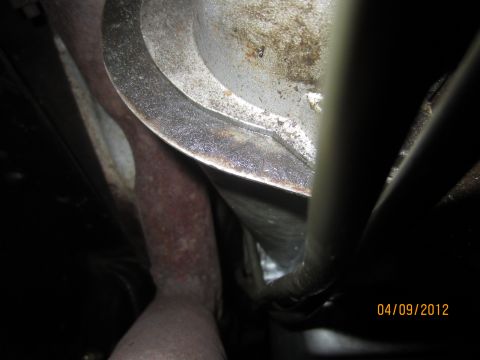 1979 Ford Bronco - Underside view of exhaust pipes and transmission housing, likely from a vehicle.