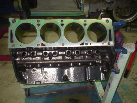 1957 Ford Custom Sedan - Engine block on a stand, ready for assembly or rebuild. Part number 045F-B is visible on the side.