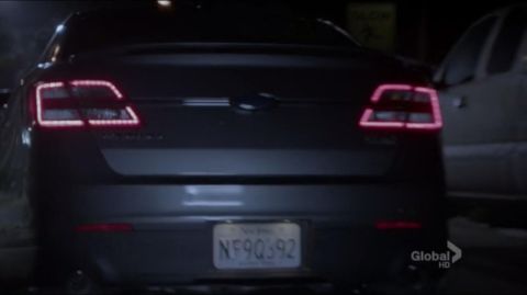 1993 Ford Taurus - The taillights of this sedan have a unique rectangular design with illuminated segments.
