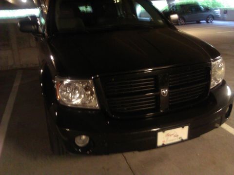2007 Dodge Durango - Front view of a black 2007 Dodge Durango, its distinctive grille and headlights.