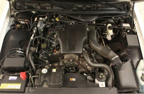 2004 Mercury Grand Marquis - The engine bay of a vehicle, showing the V8 engine and associated components.