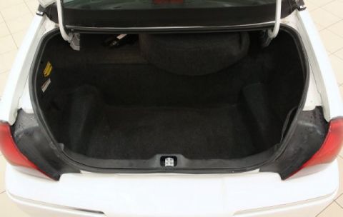 2004 Mercury Grand Marquis - The spacious trunk of a 2004 Mercury Grand Marquis is shown, complete with a spare tire and carpeting.
