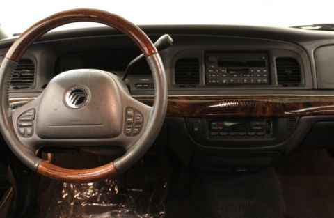 2004 Mercury Grand Marquis - Interior view of a 2004 Mercury Grand Marquis, showing the dashboard, steering wheel, and center console.