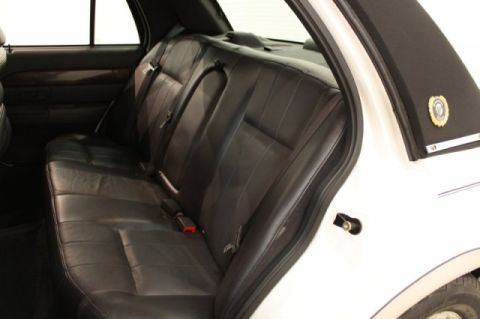 2004 Mercury Grand Marquis - Interior view of the rear leather seats and door panel of a 2004 Mercury Grand Marquis LS Ultimate.