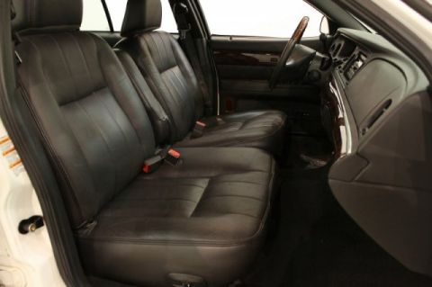 2004 Mercury Grand Marquis - Interior view of a 2003 Mercury Grand Marquis, showing the front seats and dashboard.