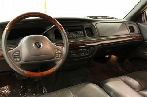 2004 Mercury Grand Marquis - The interior of a 2004 Mercury Grand Marquis LS Ultimate features wood grain trim and comfortable leather seating.