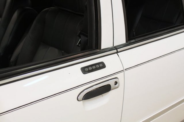 2004 Mercury Grand Marquis driver's side door with keypad entry and black leather interior visible
