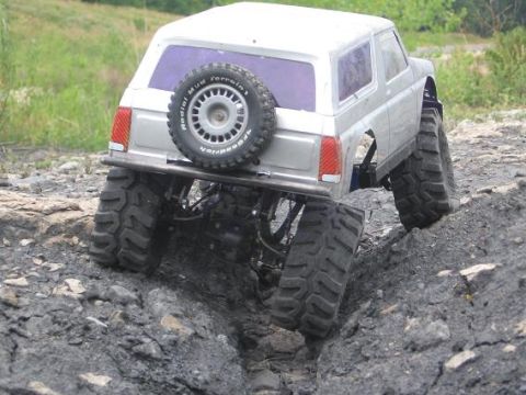 1986 Ford Bronco - This remote control truck is designed for off-road adventures, with large tires and a spare wheel.