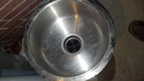 2000 Mercury Grand Marquis - The drain assembly of a kitchen sink is shown, with a visible garbage disposal unit underneath.