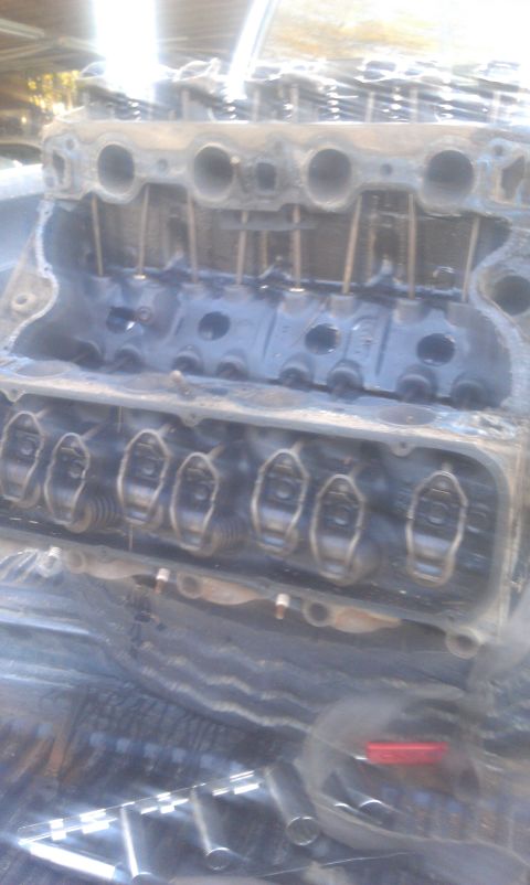 1978 Ford Bronco - Close-up of an engine block showing internal components and some grime.