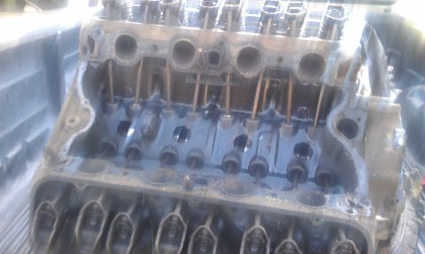 1978 Ford Bronco - Engine block with internal components visible, likely removed from a vehicle.