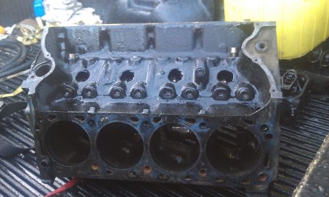 1978 Ford Bronco - Engine block shown in a truck bed, likely for a rebuild or parts sale.