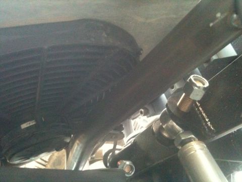 1966 Ford Bronco - Close-up of the vehicle's undercarriage, showing suspension parts and exhaust system.