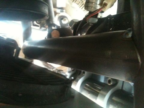 1966 Ford Bronco - Close-up view of a vehicle's undercarriage, showing mechanical parts and suspension.