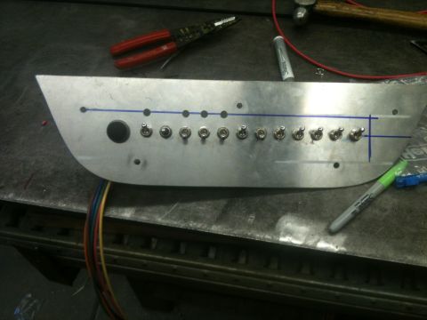 1966 Ford Bronco - A custom aluminum dashboard panel is shown with multiple toggle switches and wiring, suggesting a custom vehicle build.