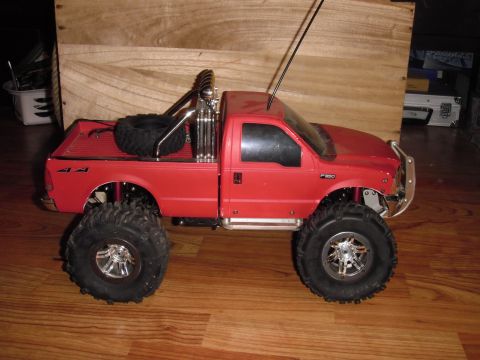 1993 Ford Bronco - This remote-controlled truck has oversized wheels and a roll bar in the bed.