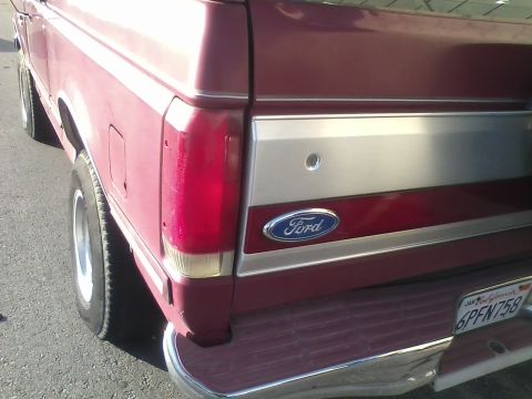 1991 Ford Bronco - The rear of a 1991 Ford Bronco shows its distinctive badging and taillight design.