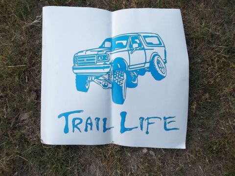 1995 Ford Bronco - A graphic depicting a lifted Bronco and the phrase 'TRAIL LIFE' is displayed on a white surface.