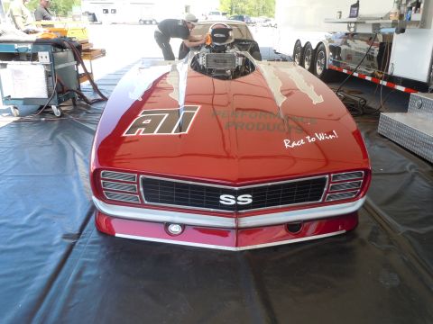 1982 Chevrolet Camaro - A custom red drag car is prepped for racing, a prominent SS badge and racing decals.