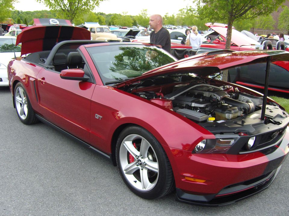 Red 2007 Ford Mustang GT convertible with engine exposed